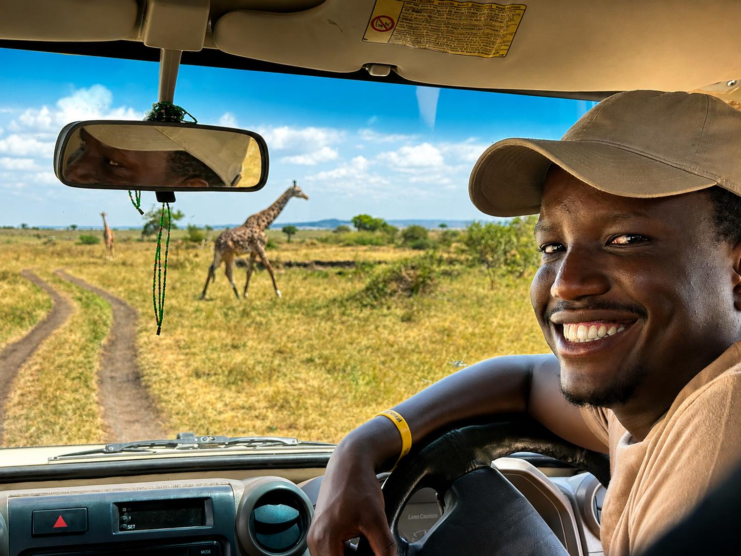 Collin Shuma, founder of African Verse Safaris, at the wheel of a safari vehicle